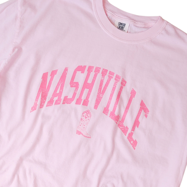 Step up your country style with our Nashville T-shirt! Made with Comfort Colors brand fabric, this cowgirl/cowboy boot themed shirt is perfect for any Nashville outfit. Pink, cute, trendy, and comfortable, size up for an oversized fit. Represent your country girl personality with this must-have graphic tee.