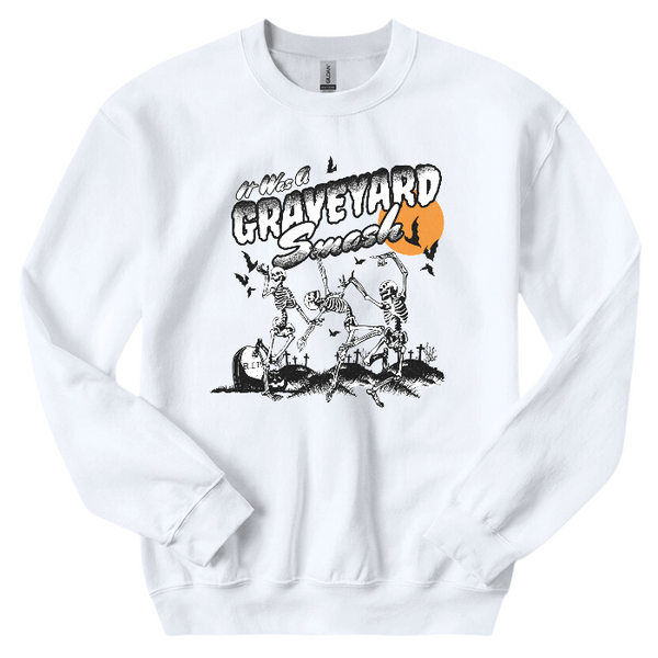 This Halloween, make a statement with our Halloween graveyard smash dancing skeleton t-shirt! Featuring a retro skeleton design, this shirt is perfect for the spooky season and will add a touch of vintage style to your fall wardrobe. Available in both comfort color t-shirts and Gildan crewneck sweatshirts, size up for an oversized fit. Get yours today!