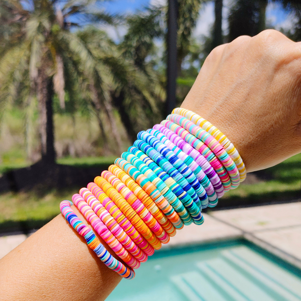 Our preppy, colorful, and bright mixed clay bracelets make the perfect summer (and beyond) accessory! With bright clay heishi beads, you can create unique stacking bracelets to match any outfit. The perfect gift idea for someone special!