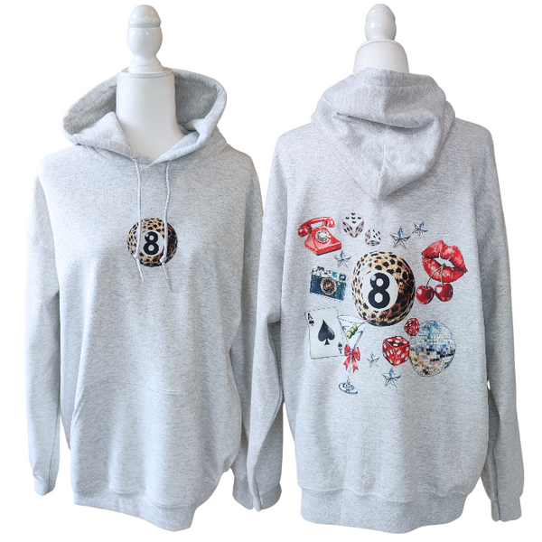 Unleash your inner luck and style with our Leopard 8 Ball Lucky Collage Hoodie. This trendy hoodie features a unique design of animal print, lucky symbols, and y2k style elements like dice, cherries, and disco balls. Perfect for a preppy aesthetic look, size up for an oversized fit.
