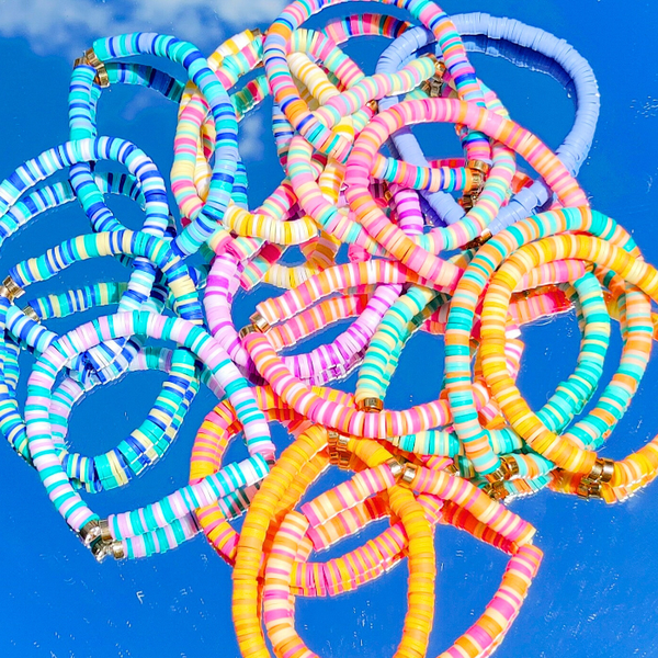 Our preppy, colorful, and bright mixed clay bracelets make the perfect summer (and beyond) accessory! With bright clay heishi beads, you can create unique stacking bracelets to match any outfit. The perfect gift idea for someone special!