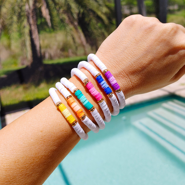Express your summer style with these bright and cheerful Ombre Preppy Bracelets! Featuring a mix of Heishi clay beads, these colorful bracelets are perfect to wear alone or stacking to add a little fun to any outfit. Great for gifts for her! Who wouldn't love these cheerful, summer-inspired bracelets?