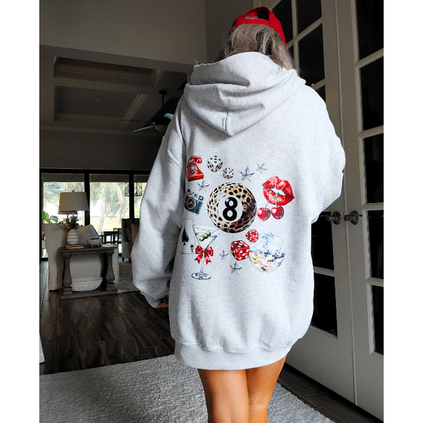 Unleash your inner luck and style with our Leopard 8 Ball Lucky Collage Hoodie. This trendy hoodie features a unique design of animal print, lucky symbols, and y2k style elements like dice, cherries, and disco balls. Perfect for a preppy aesthetic look, size up for an oversized fit.