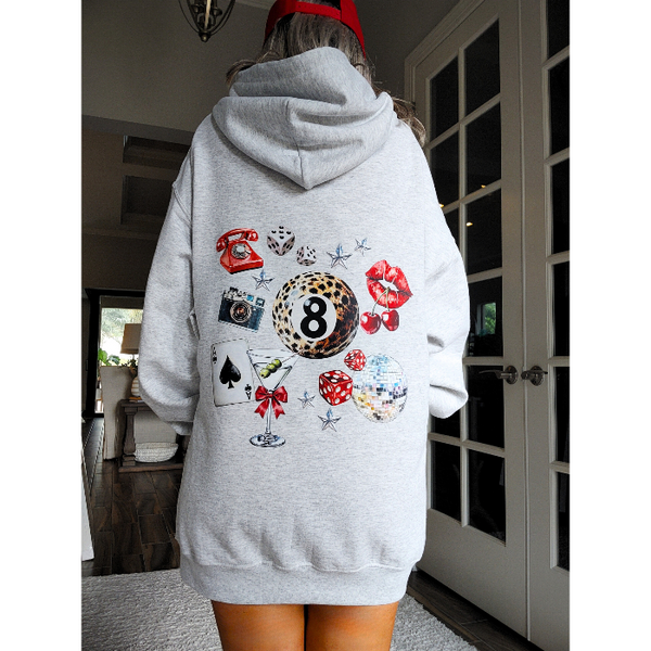 Unleash your inner luck and style with our Leopard 8 Ball Lucky Collage Hoodie. This trendy hoodie features a unique design of animal print, lucky symbols, and y2k style elements like dice, cherries, and disco balls. Perfect for a preppy aesthetic look, size up for an oversized fit.