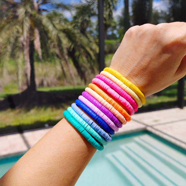 Brighten your summer look with these cheerful preppy bracelets! Crafted with colorful clay beads, they are perfect for stacking or wearing alone for a splash of fun. Great for accessorizing any outfit or as a gift idea - these beaded bracelets are sure to brighten up your day!