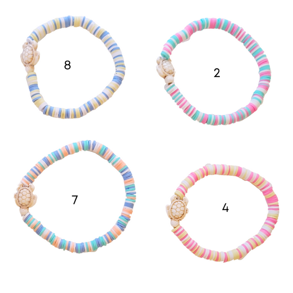 The Preppy Turtle Bracelet is perfect for summer! This eye-catching accessory features colorful Heishi clay beads and stone turtle bead to create an ocean-inspired look. It's perfect for stacking or gifting to someone special. With its unique design and mix of colors, this stretch bracelet is sure to stand out!