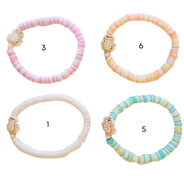 The Preppy Turtle Bracelet is perfect for summer! This eye-catching accessory features colorful Heishi clay beads and stone turtle bead to create an ocean-inspired look. It's perfect for stacking or gifting to someone special. With its unique design and mix of colors, this stretch bracelet is sure to stand out!