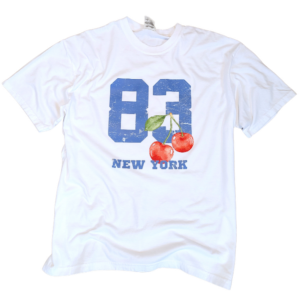 Introducing our 80's inspired Retro Sporty Shirt, featuring a vibrant Cherry graphic design and a nod to the iconic New York City. This trendy top is perfect for the preppy aesthetic and a must-have for any sports lover. Available in comfort color t-shirts and Gildan crewneck sweatshirts, size up for an oversized fit.