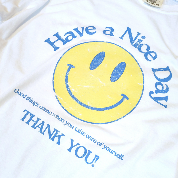 Spread positivity with our retro distressed vintage inspired smile face t-shirt. This 70s style shirt features a trendy, positive design and is available in both comfort color t-shirts and Gildan crewneck sweatshirts. Size up for an oversized, preppy aesthetic look. Perfect for those looking to make a statement and spread happy vibes. Thank us later!