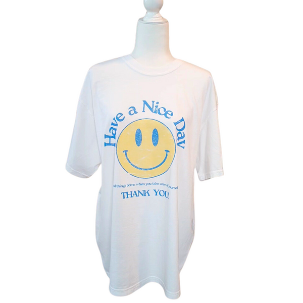 Spread positivity with our retro distressed vintage inspired smile face t-shirt. This 70s style shirt features a trendy, positive design and is available in both comfort color t-shirts and Gildan crewneck sweatshirts. Size up for an oversized, preppy aesthetic look. Perfect for those looking to make a statement and spread happy vibes. Thank us later!