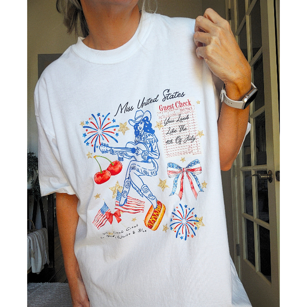 Get ready to celebrate in style with our 4th of July charms inspired cowgirl t-shirt! Made with 100% cotton from Comfort Colors, it's not only trendy but so comfortable. Featuring a playful tagline "You look like the fourth of July" and a coquette preppy bow design, this shirt is perfect for summer and all year around for showing off your patriotic pride. Don't forget to size up for an oversized look.