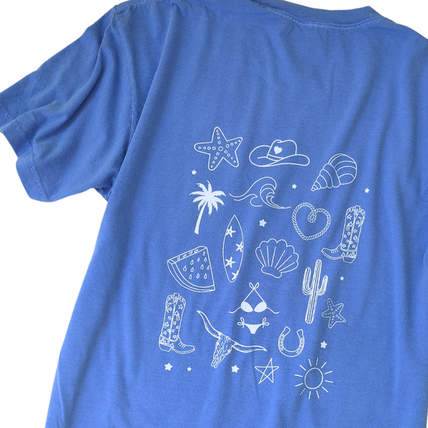 This Cowgirls Coastal Beach Club Graphic Tee is the perfect blend of western charm and summer style! This blue tee features a minimal front text and a fun beachy western graphic on the back—designed for trend-lovers and sunshine-chasers. Great for pairing with denim shorts, cowboy boots, or a trucker hat for the full cowgirl vibe. For that oversized, slouchy look, size up!