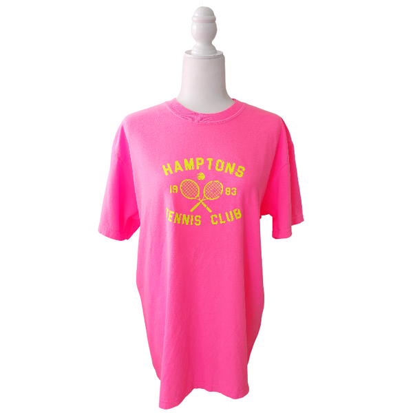 Serve up some serious style with the Hamptons Tennis Club T-Shirt! This preppy tee is the perfect way to add a pop of color to your to your summer wardrobe. Comfortable and stylish, it's perfect for the beach, pool or simply enjoying a warm day. But it's not just about style - this neon pink t-shirt, made by comfort colors is made with comfort in mind. Get ready to be the trendsetter this summer (and don't forget to size up for a trendy oversized fit!)