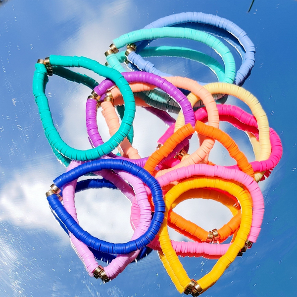 Brighten your summer look with these cheerful preppy bracelets! Crafted with colorful clay beads, they are perfect for stacking or wearing alone for a splash of fun. Great for accessorizing any outfit or as a gift idea - these beaded bracelets are sure to brighten up your day!