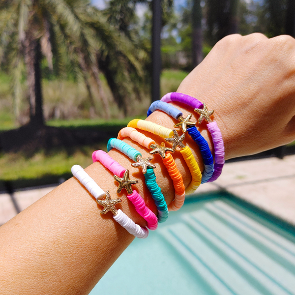 Bring the ocean to your accessory collection with our Preppy Starfish Bracelet. Adorned with a two tone colorful Heishi Clay beads, this summer bracelet is perfect for gifting or accessorizing your own look. Enjoy the bold bright ocean vibes and stretch fit of this bracelet, also perfect for stacking.