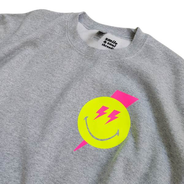 Smiley Face Lightning Bolt Crewneck Sweatshirt.