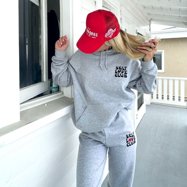 self love club smiley heart sweatpants