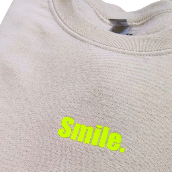 Neon Yellow Smiley Face Sweatshirt in the color Sand.
