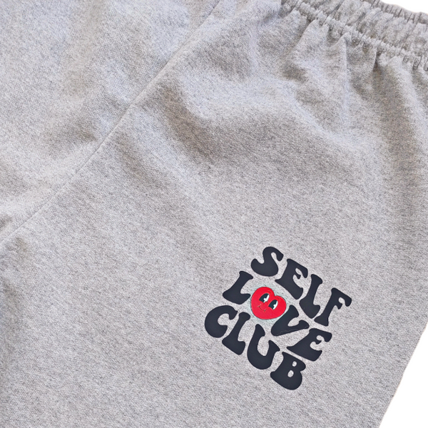 self love club smiley heart sweatpants