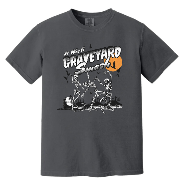 This Halloween, make a statement with our Halloween graveyard smash dancing skeleton t-shirt! Featuring a retro skeleton design, this shirt is perfect for the spooky season and will add a touch of vintage style to your fall wardrobe. Available in both comfort color t-shirts and Gildan crewneck sweatshirts, size up for an oversized fit. Get yours today!