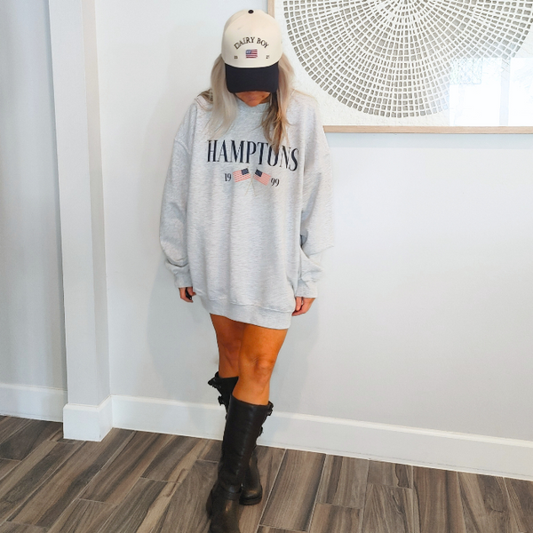 Get ready to show off your vacation vibes with our Hamptons American Flag Sweatshirt! This trendy and preppy sweatshirt features a bold and oversized graphic design, perfect for those summer beach days. Made with a comfy blend of 50% cotton and 50% polyester, it's the perfect addition to your wardrobe. Size up for an even more oversized fit. Live your best Hamptons life in style.
