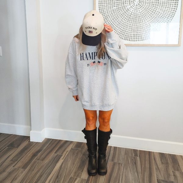Get ready to show off your vacation vibes with our Hamptons American Flag Sweatshirt! This trendy and preppy sweatshirt features a bold and oversized graphic design, perfect for those summer beach days. Made with a comfy blend of 50% cotton and 50% polyester, it's the perfect addition to your wardrobe. Size up for an even more oversized fit. Live your best Hamptons life in style.