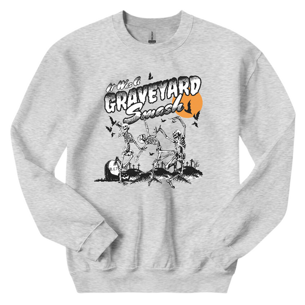 This Halloween, make a statement with our Halloween graveyard smash dancing skeleton t-shirt! Featuring a retro skeleton design, this shirt is perfect for the spooky season and will add a touch of vintage style to your fall wardrobe. Available in both comfort color t-shirts and Gildan crewneck sweatshirts, size up for an oversized fit. Get yours today!