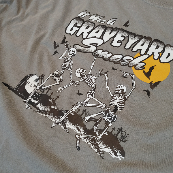 This Halloween, make a statement with our Halloween graveyard smash dancing skeleton t-shirt! Featuring a retro skeleton design, this shirt is perfect for the spooky season and will add a touch of vintage style to your fall wardrobe. Available in both comfort color t-shirts and Gildan crewneck sweatshirts, size up for an oversized fit. Get yours today!