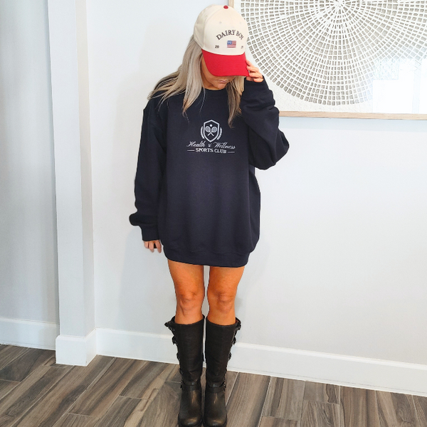 This Health and Wellness Sports Club Sweatshirt is perfect for preppy and sporty looks. Its tennis club inspired design features soft fabric and a trendy athleisure style that is perfect for any activity. Get wellness and fashion in one stylish package!
