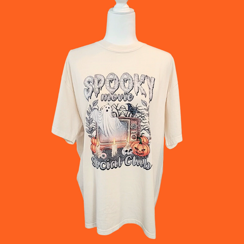 Conquer your fears with our Spooky Movie Social Club T-shirt! Show your love for horror movies and celebrate Halloween in style with our retro, vintage design. Available in comfort color t-shirts and Gildan crewneck sweatshirts, you can size up for an oversized fit. Be bold, be daring, be spooky! Order now!