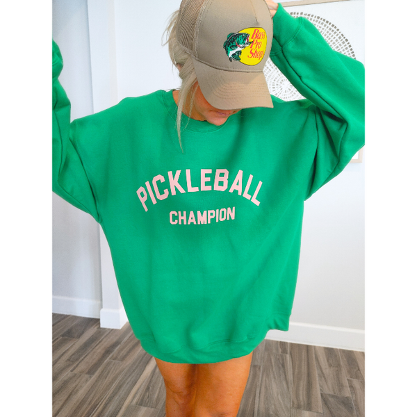 This Pickleball Champion Sweatshirt is an ideal preppy gift for any pickleball lover! Its fashionable and comfortable, making it the perfect choice for a trendy game day look. Whether you're heading to the court or just lounging around, you'll love showing your pickleball passion in this cute sweatshirt.