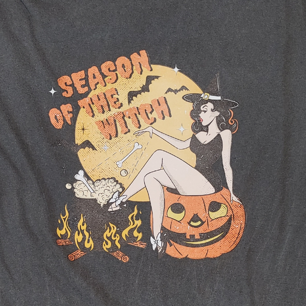 Get into the spooky spirit with our Season of the Witch Shirt. The distressed vintage Halloween design adds retro charm to this cute and funny shirt. With witchy vibes and a variety of options, including comfort color t-shirts and Gildan crewneck sweatshirts, you'll be ready for Halloween in style. (Size up for an oversized fit!)