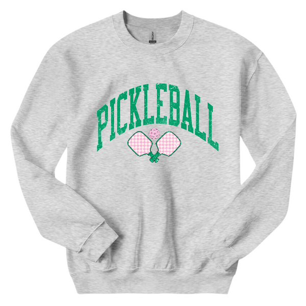 Ready to serve up some serious style? This distressed green and pink pickleball sweatshirt is the perfect gift for any pickleball lover or team. Made with a comfy 50/50 cotton-polyester blend, size up for an oversized fit and dominate the court with a preppy and trendy look.