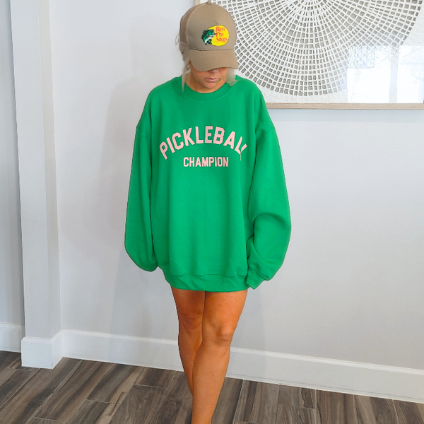 This Pickleball Champion Sweatshirt is an ideal preppy gift for any pickleball lover! Its fashionable and comfortable, making it the perfect choice for a trendy game day look. Whether you're heading to the court or just lounging around, you'll love showing your pickleball passion in this cute sweatshirt.