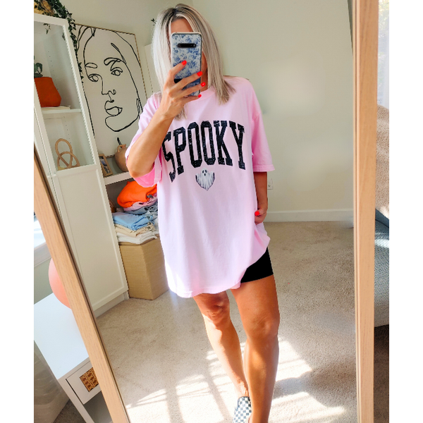 Introducing our Spooky Varsity Lettering Ghost T-Shirt, perfect for Halloween parties and spooky season. This distressed, design features a cute ghost and is available in comfort color t-shirts. Size up for an oversized, yet stylish fit. Make a statement with our exclusive Spooky Halloween Shirt.