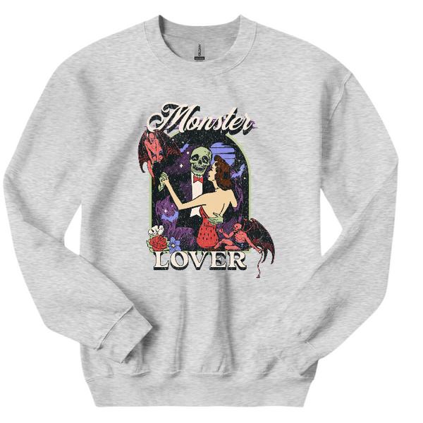 Get ready for spooky season with our vintage-inspired Monster Lover shirt! Perfect for fans of Halloween horror movies, this trendy shirt features a retro Halloween design. Available in both comfort color t-shirts and Gildan crewneck sweatshirts, this shirt is perfect for any Halloween lover. Size up for an oversized fit and make a statement this Halloween!