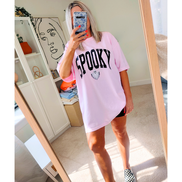 Introducing our Spooky Varsity Lettering Ghost T-Shirt, perfect for Halloween parties and spooky season. This distressed, design features a cute ghost and is available in comfort color t-shirts. Size up for an oversized, yet stylish fit. Make a statement with our exclusive Spooky Halloween Shirt.