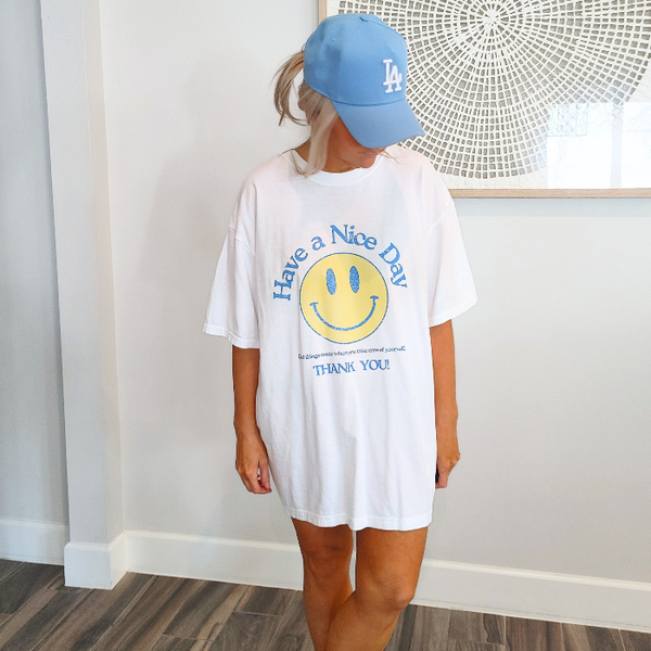 Spread positivity with our retro distressed vintage inspired smile face t-shirt. This 70s style shirt features a trendy, positive design and is available in both comfort color t-shirts and Gildan crewneck sweatshirts. Size up for an oversized, preppy aesthetic look. Perfect for those looking to make a statement and spread happy vibes. Thank us later!