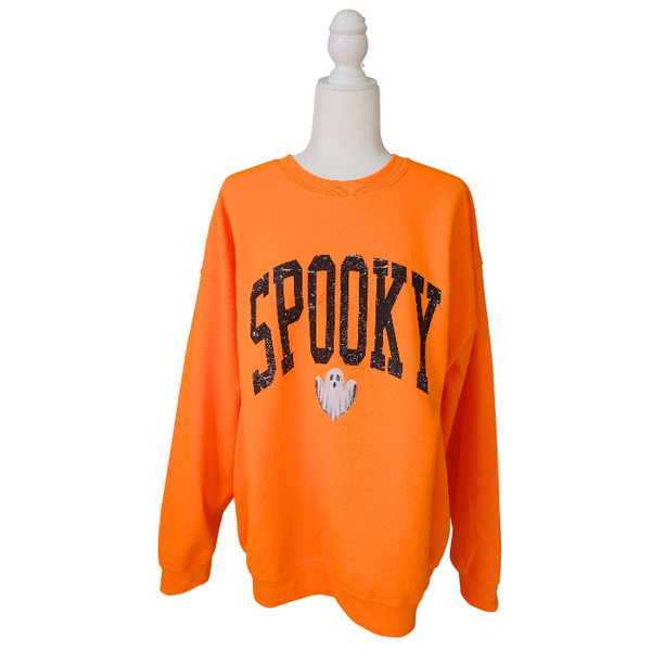 Unleash your spooky style with our Spooky Ghost Sweatshirt! Featuring a cute ghost with the word SPOOKY in varsity lettering and a distressed design, this sweatshirt is perfect for Halloween parties and the entire spooky season. Size up for an oversized fit. Get yours today and join the ghost squad!