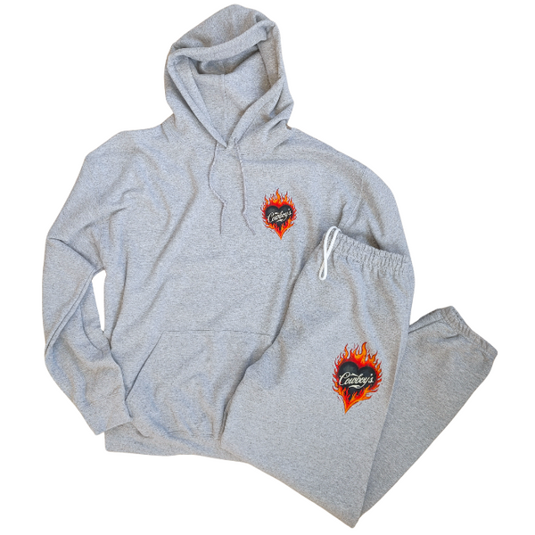 This matching Cowboys flame sweatshirt and sweatpants set delivers bold western style with all-day comfort. Featuring a fiery heart “Cowboys” graphic, this gray lounge set is perfect for cozy days, casual outings, travel, or effortless cowgirl street style.