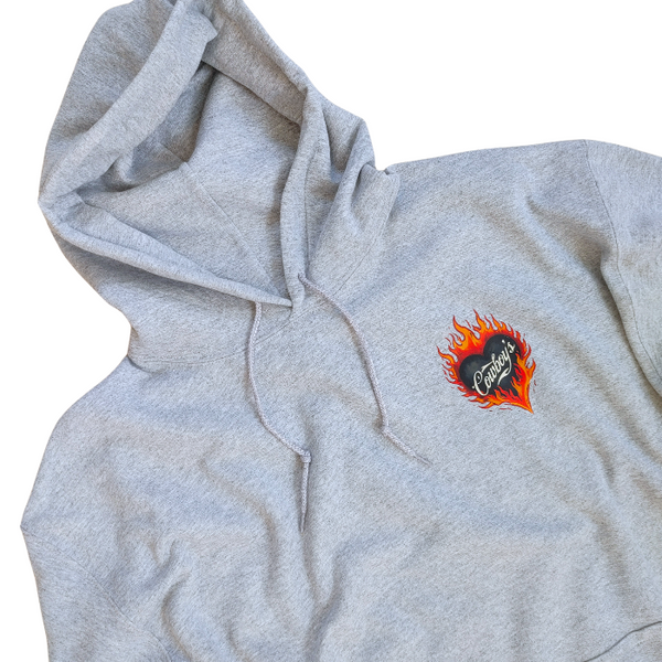 Turn up the western vibes with this Cowboys flame hoodie sweatshirt, featuring a bold flaming heart “Cowboys” graphic that makes a statement from every angle. Designed on a classic sports gray pullover hoodie, this piece blends edgy cowgirl style with everyday comfort—perfect for casual wear, concerts, or laid-back weekends.

This hoodie is made with a soft and cozy 50% cotton / 50% polyester blend, giving it warmth without feeling heavy. 