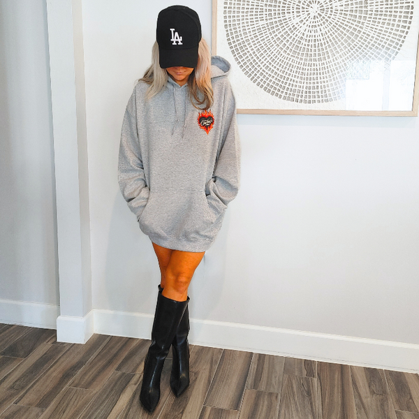 Turn up the western vibes with this Cowboys flame hoodie sweatshirt, featuring a bold flaming heart “Cowboys” graphic that makes a statement from every angle. Designed on a classic sports gray pullover hoodie, this piece blends edgy cowgirl style with everyday comfort—perfect for casual wear, concerts, or laid-back weekends.

This hoodie is made with a soft and cozy 50% cotton / 50% polyester blend, giving it warmth without feeling heavy. 