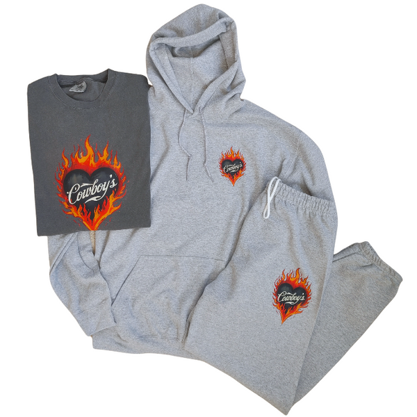 This matching Cowboys flame sweatshirt and sweatpants set delivers bold western style with all-day comfort. Featuring a fiery heart “Cowboys” graphic, this gray lounge set is perfect for cozy days, casual outings, travel, or effortless cowgirl street style.
