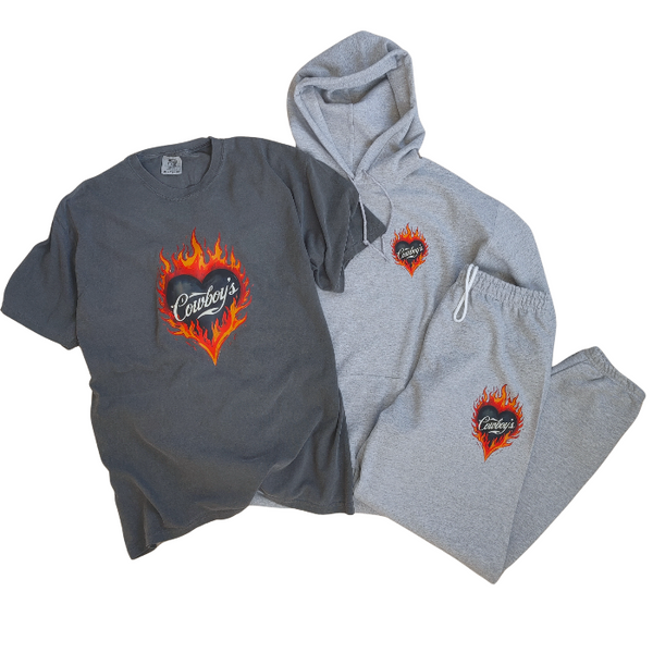 This matching Cowboys flame sweatshirt and sweatpants set delivers bold western style with all-day comfort. Featuring a fiery heart “Cowboys” graphic, this gray lounge set is perfect for cozy days, casual outings, travel, or effortless cowgirl street style.