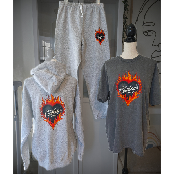 Turn up the heat with this Cowboys flame graphic t-shirt, designed for effortless western style with a modern, trendy edge. This vintage-inspired tee features a bold flaming heart “Cowboys” graphic on a rich pepper-colored base, giving it that worn-in, lived-in look everyone loves.