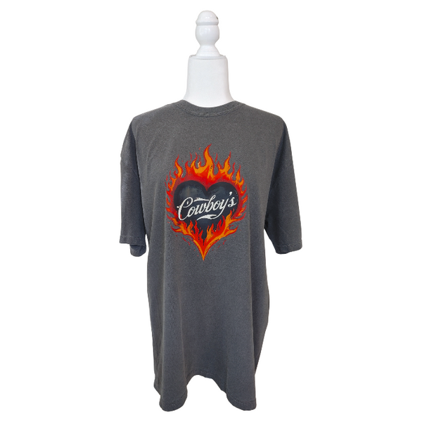 Turn up the heat with this Cowboys flame graphic t-shirt, designed for effortless western style with a modern, trendy edge. This vintage-inspired tee features a bold flaming heart “Cowboys” graphic on a rich pepper-colored base, giving it that worn-in, lived-in look everyone loves.
