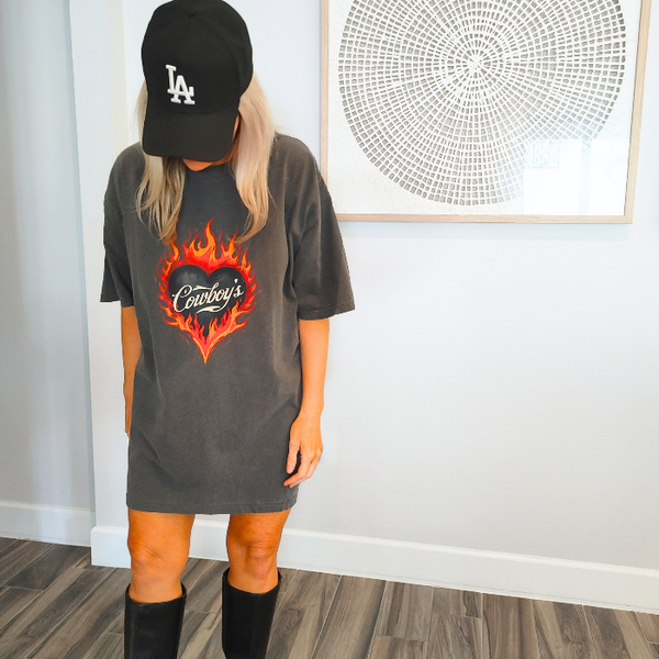 Turn up the heat with this Cowboys flame graphic t-shirt, designed for effortless western style with a modern, trendy edge. This vintage-inspired tee features a bold flaming heart “Cowboys” graphic on a rich pepper-colored base, giving it that worn-in, lived-in look everyone loves.