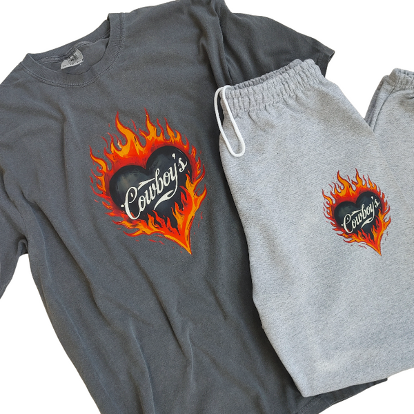 Turn up the heat with this Cowboys flame graphic t-shirt, designed for effortless western style with a modern, trendy edge. This vintage-inspired tee features a bold flaming heart “Cowboys” graphic on a rich pepper-colored base, giving it that worn-in, lived-in look everyone loves.