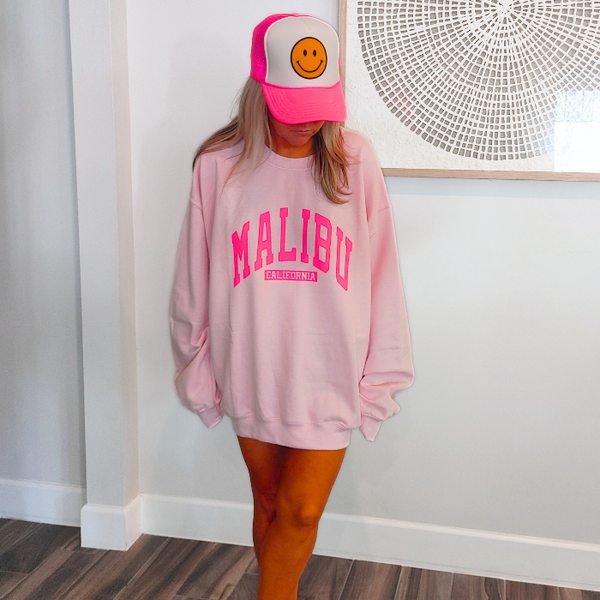 Our super soft pink Malibu crewneck is a great stylish and trendy piece. The Malibu California sweatshirt is perfect for layering or wearing alone for a casual look. With neon pink lettering, this sweatshirt is preppy in style and also makes the perfect gift! Don't forget to size up for an oversized trendy look.