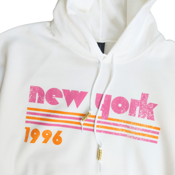 This New York Hoodie is the perfect blend of retro style and everyday comfort. Featuring a distressed New York graphic with vibrant pink and orange stripes, metallic gold beaded drawstrings, and a cozy unisex fit, it's a statement hoodie made for city lovers, travelers, and anyone who loves a bold vintage-inspired aesthetic. Size up 1–2 sizes for a cozy oversized look.
